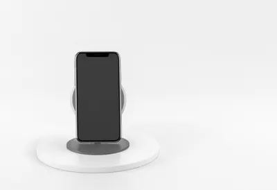Smartphone on a Wireless Charger in a clean studio