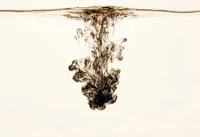 Ink Dispersing in Water in warm tones