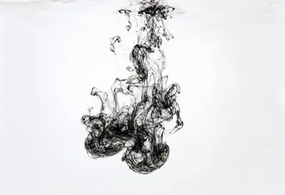 Ink Dispersing in Water in a soft palette