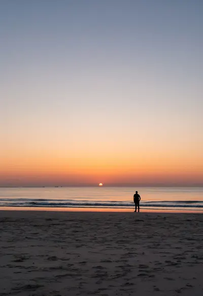 Silhouette on a Beach at Sunset at dusk