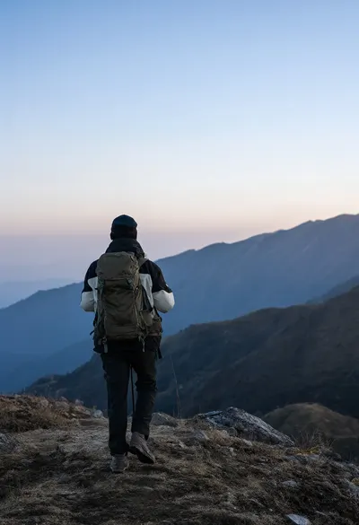 Back View of a Hiker on a Ridge at dusk