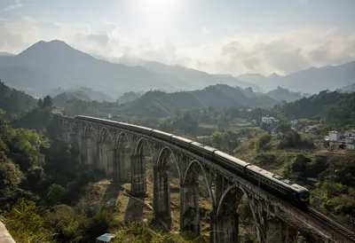 Train Crossing A Viaduct In A Valley