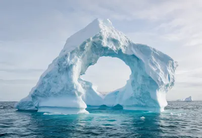 Iceberg Arch in Cold Water