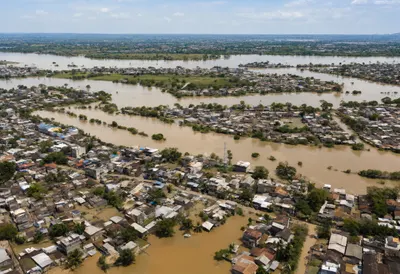 River Flooding a Village from Above