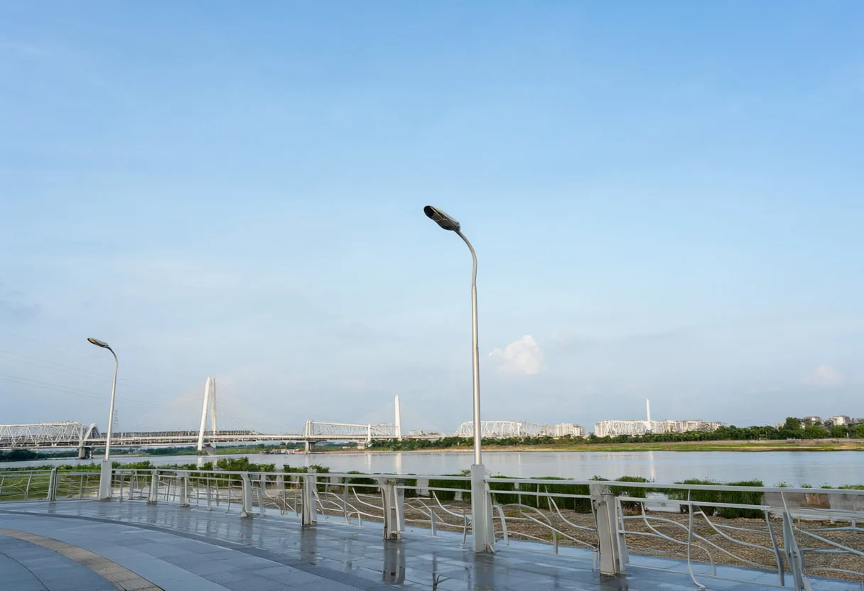 Riverside promenade after rain, wide angle