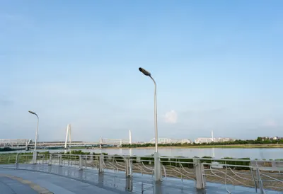 Riverside promenade after rain, wide angle