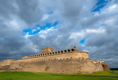 Old fortress with dramatic clouds, wide angle