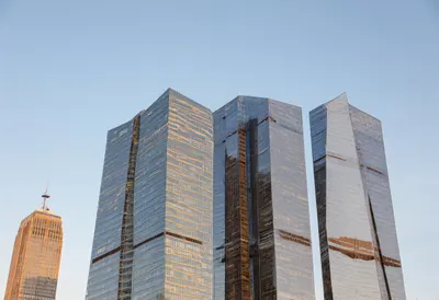 Glass towers at golden hour, low angle