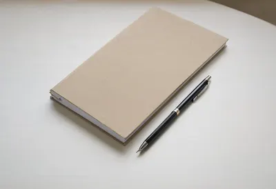Pen and folder in soft daylight, wide angle