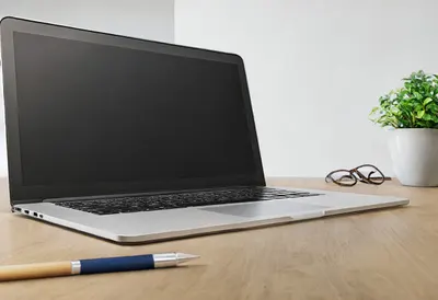 Desk with laptop in a minimal setting, low angle