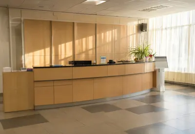 Reception desk with warm window light, low angle