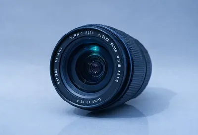 Camera lens macro with cool blue light, low angle