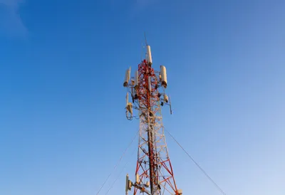 Telecom tower at dusk, low angle
