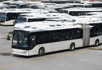 Electric bus depot under natural daylight, high angle