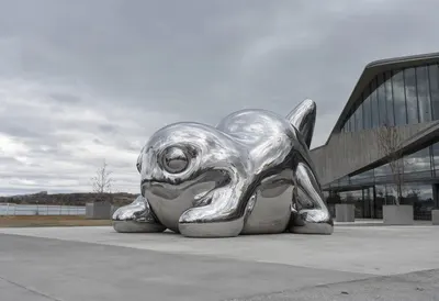 Chrome blob in a deep palette, wide angle