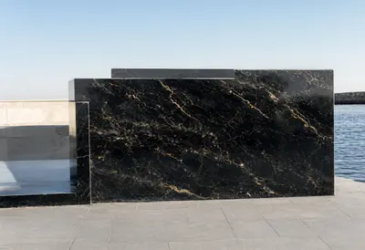 Black marble gold with subtle grain, wide angle